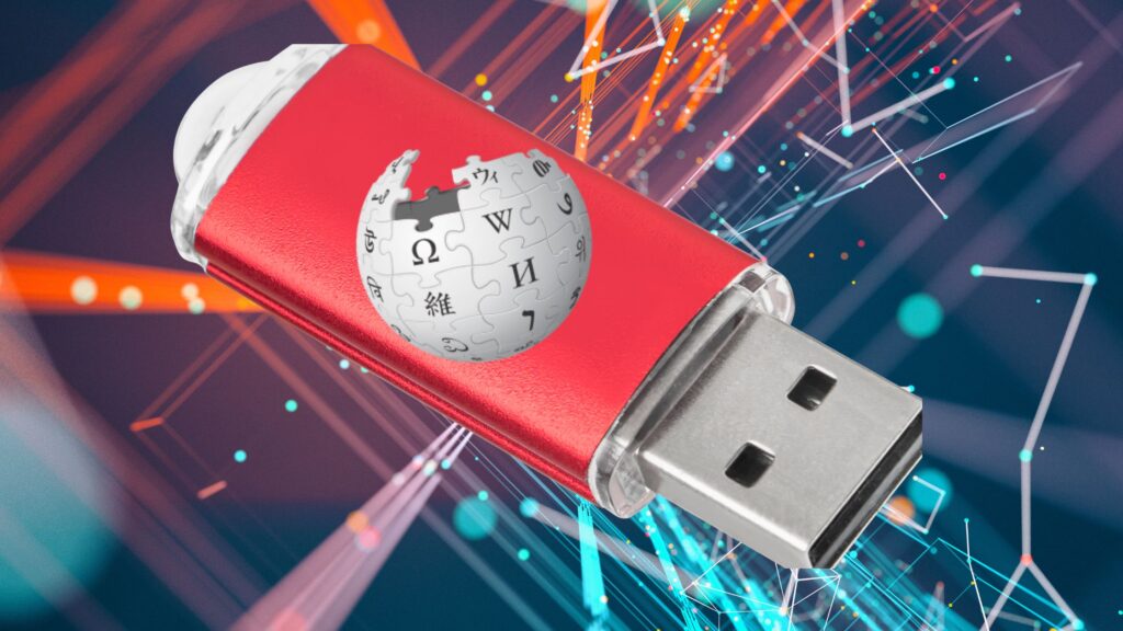 Wikipedia logo on red flash drive over abstract background